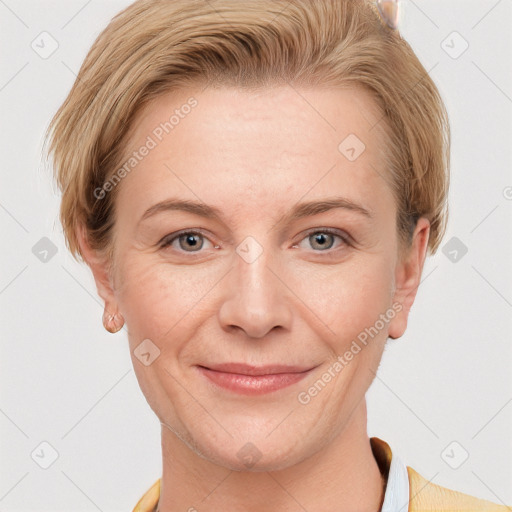 Joyful white adult female with short  brown hair and grey eyes