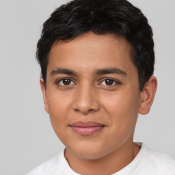 Joyful latino young-adult male with short  brown hair and brown eyes