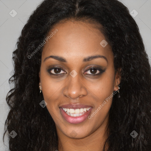 Joyful black young-adult female with long  black hair and brown eyes