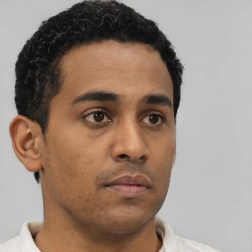 Neutral latino young-adult male with short  brown hair and brown eyes