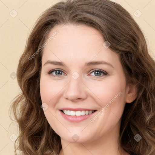 Joyful white young-adult female with long  brown hair and green eyes