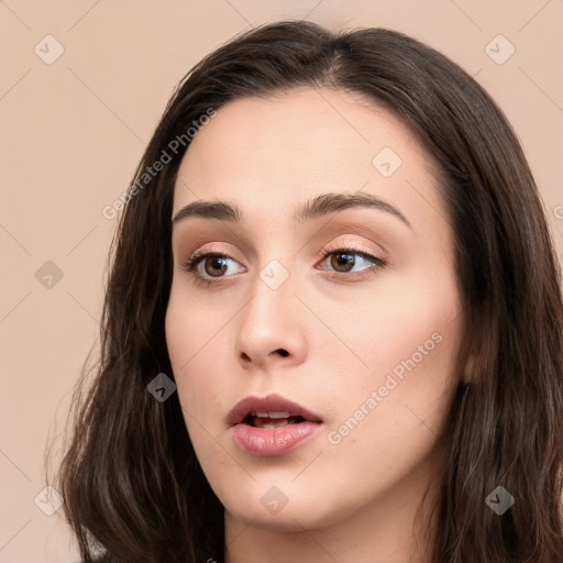 Neutral white young-adult female with long  brown hair and brown eyes