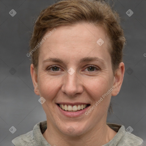 Joyful white adult female with short  brown hair and grey eyes