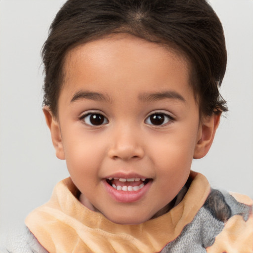 Joyful white child female with short  brown hair and brown eyes