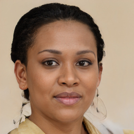 Joyful black young-adult female with medium  brown hair and brown eyes