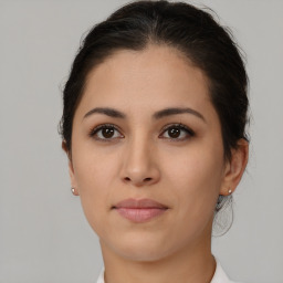 Joyful latino young-adult female with medium  brown hair and brown eyes