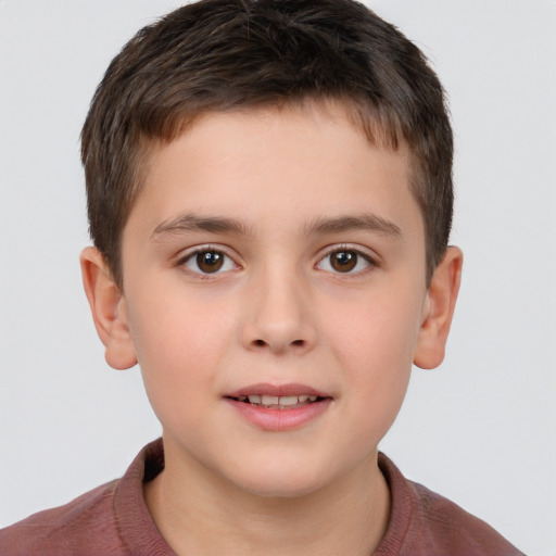 Joyful white child male with short  brown hair and brown eyes