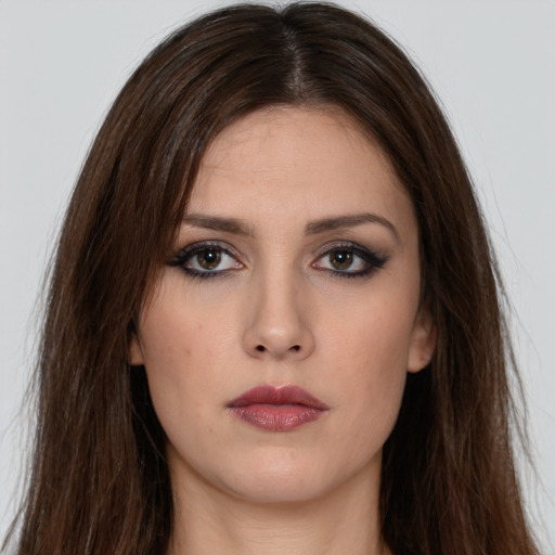 Neutral white young-adult female with long  brown hair and brown eyes