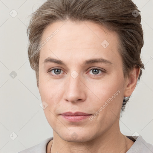 Joyful white young-adult female with short  brown hair and grey eyes