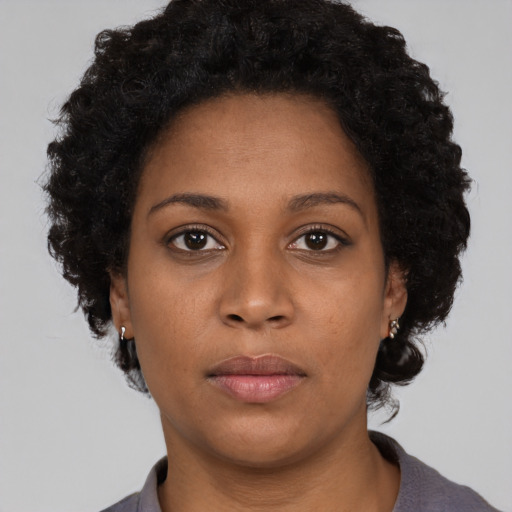 Neutral black young-adult female with short  black hair and brown eyes