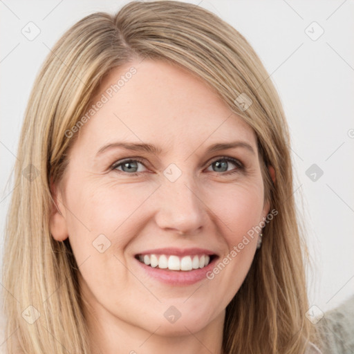 Joyful white young-adult female with long  brown hair and green eyes