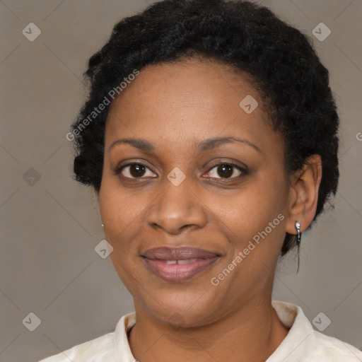 Joyful black adult female with short  black hair and brown eyes