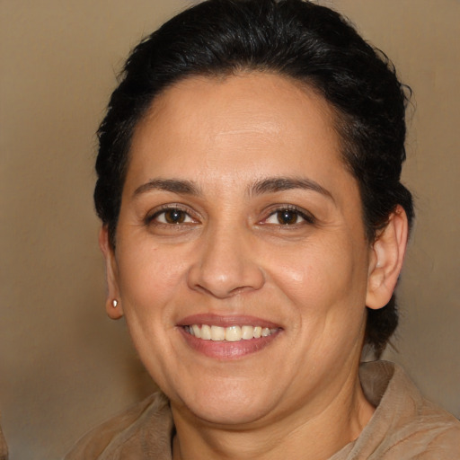 Joyful white adult female with medium  brown hair and brown eyes