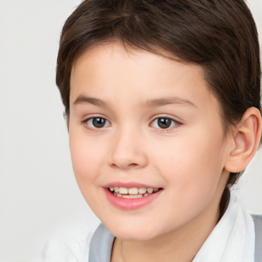 Joyful white child female with short  brown hair and brown eyes