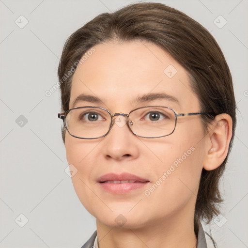 Joyful white adult female with medium  brown hair and brown eyes