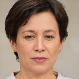 Joyful white adult female with short  brown hair and brown eyes