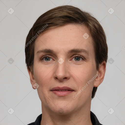 Joyful white adult female with short  brown hair and grey eyes