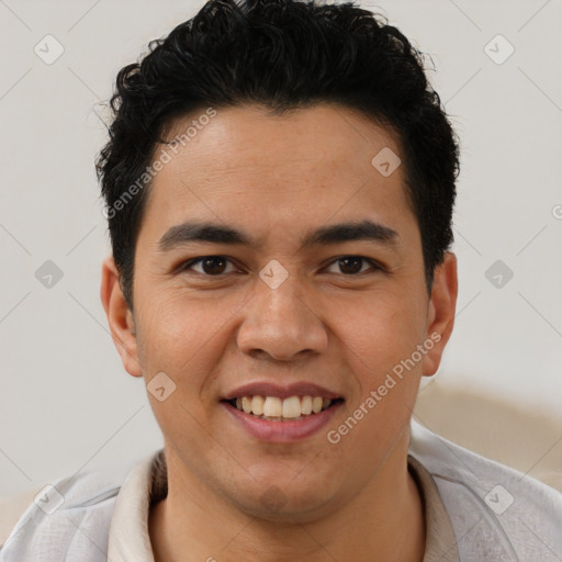 Joyful latino young-adult male with short  brown hair and brown eyes