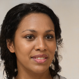 Joyful black young-adult female with medium  brown hair and brown eyes