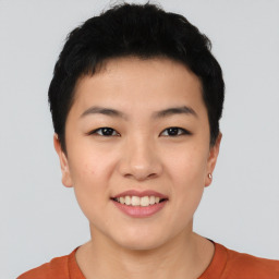 Joyful asian young-adult female with short  black hair and brown eyes