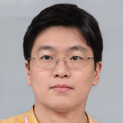 Neutral asian adult male with short  brown hair and brown eyes