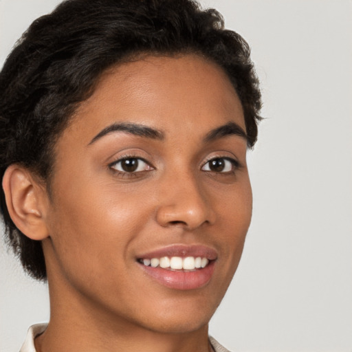 Joyful latino young-adult female with short  brown hair and brown eyes