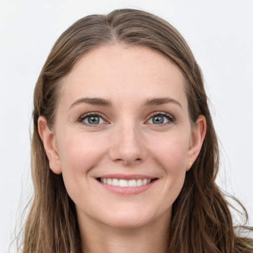 Joyful white young-adult female with long  brown hair and grey eyes