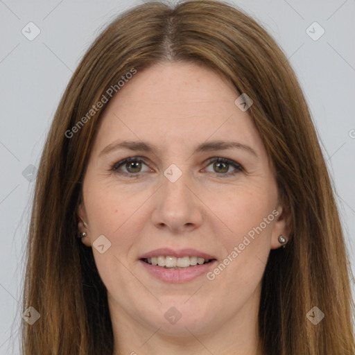 Joyful white adult female with long  brown hair and grey eyes