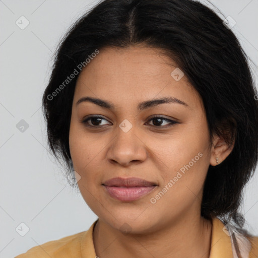 Joyful latino young-adult female with long  brown hair and brown eyes