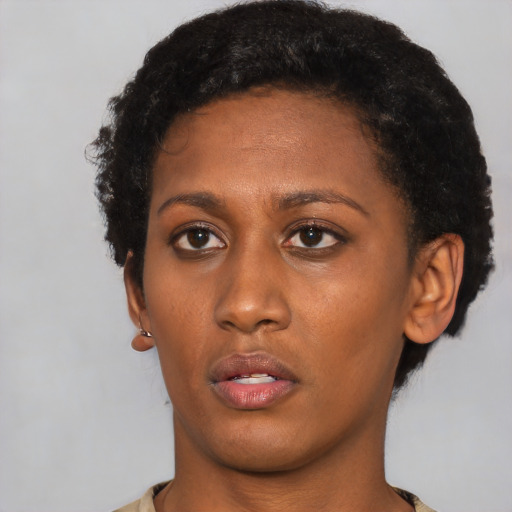 Neutral latino young-adult female with short  black hair and brown eyes