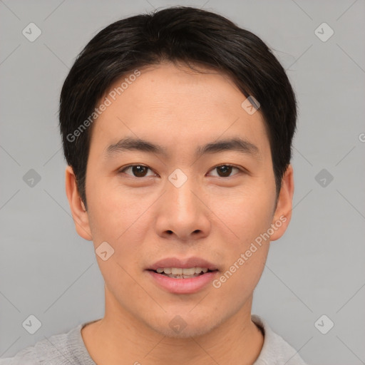 Joyful asian young-adult male with short  brown hair and brown eyes