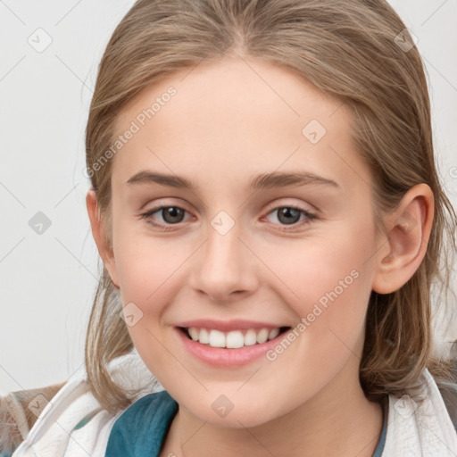 Joyful white young-adult female with medium  brown hair and blue eyes