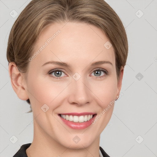 Joyful white young-adult female with short  brown hair and grey eyes