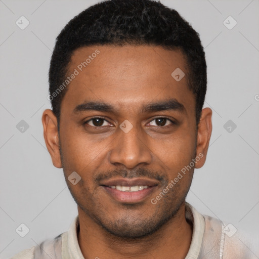 Joyful black young-adult male with short  brown hair and brown eyes