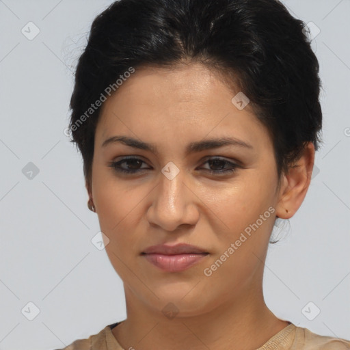 Joyful latino young-adult female with short  brown hair and brown eyes