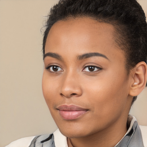 Joyful latino young-adult female with short  brown hair and brown eyes