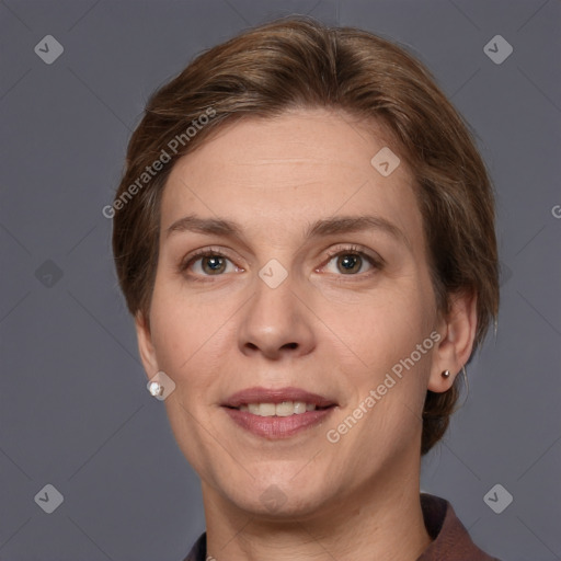 Joyful white adult female with short  brown hair and grey eyes