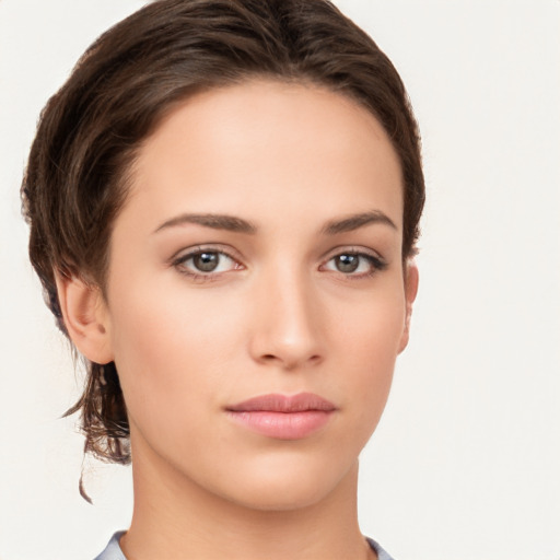 Neutral white young-adult female with short  brown hair and brown eyes