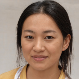 Joyful white young-adult female with medium  brown hair and brown eyes