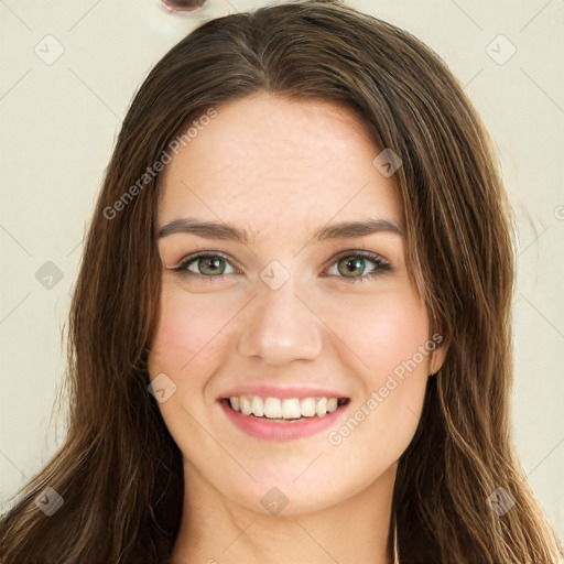 Joyful white young-adult female with long  brown hair and green eyes