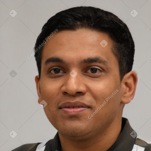 Joyful latino young-adult male with short  black hair and brown eyes