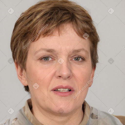 Joyful white adult female with short  brown hair and grey eyes