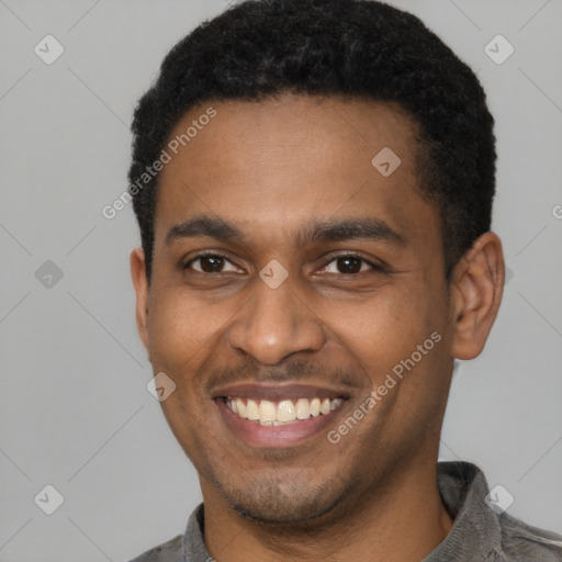 Joyful latino young-adult male with short  brown hair and brown eyes