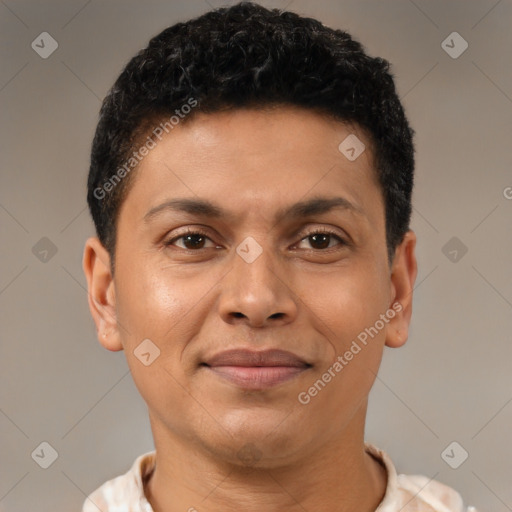 Joyful latino young-adult male with short  brown hair and brown eyes