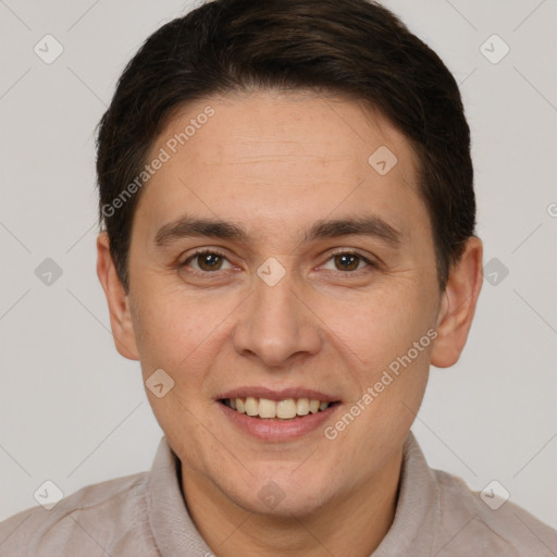 Joyful white adult male with short  brown hair and brown eyes