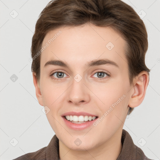 Joyful white young-adult female with short  brown hair and grey eyes