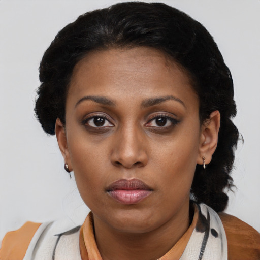 Neutral black young-adult female with medium  black hair and brown eyes