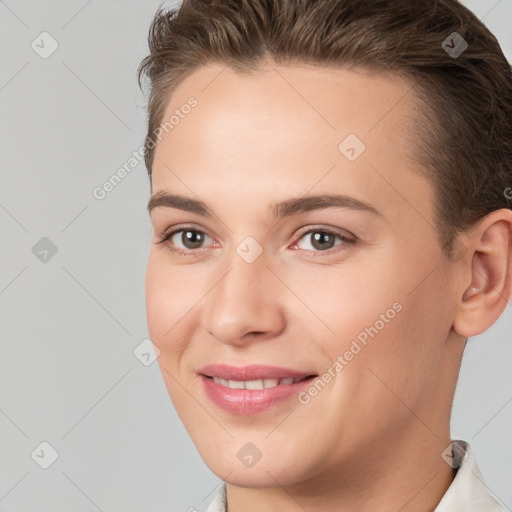 Joyful white young-adult female with short  brown hair and brown eyes