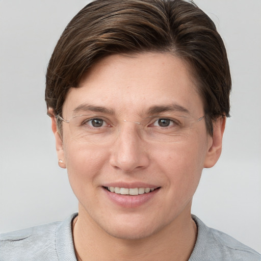 Joyful white adult female with short  brown hair and grey eyes