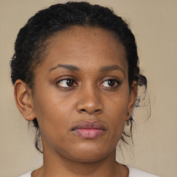 Neutral black young-adult female with short  brown hair and brown eyes